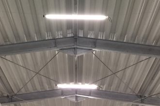 Two 49W fluorescent lamps mounted under the ceiling